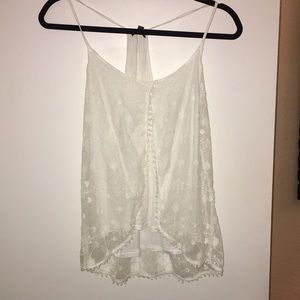 White tank with lace overlay.